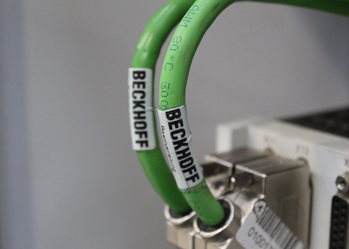 BECKHOFF stickers on cables attached to AX5000 test rig in Kontroltek workshop.